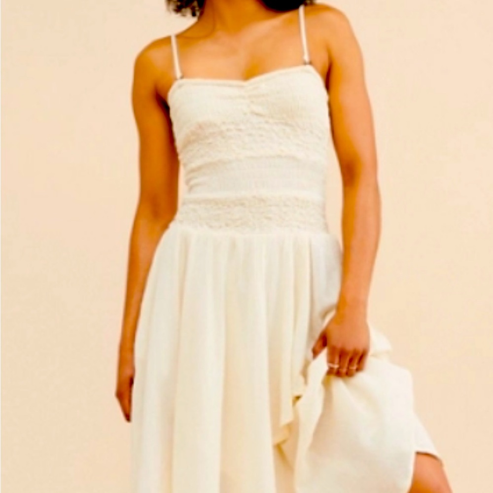 Never worn dress drop waist it’s very pretty just not for me and its100% cotton